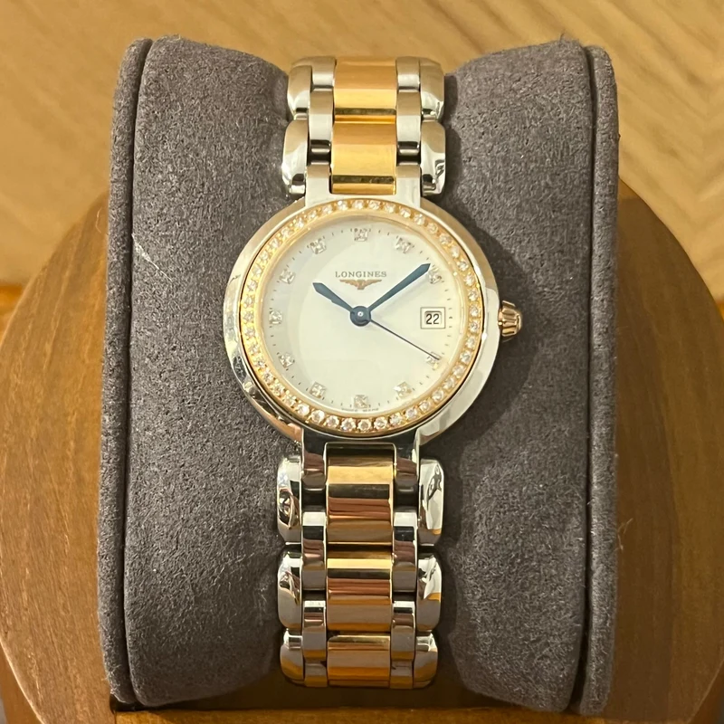 Montre Longines PrimaLuna en acier et or rose avec lunette diamantée L8.110.5